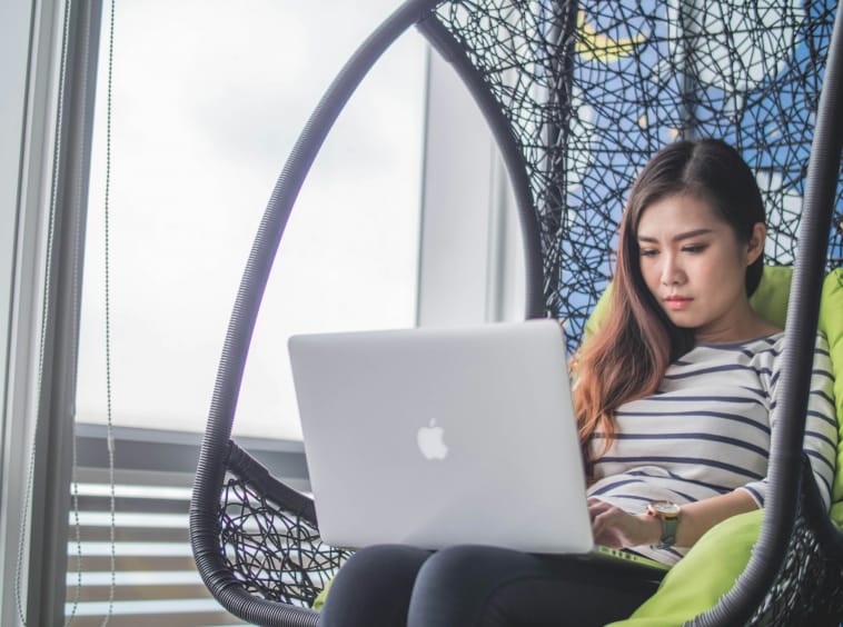 MacBook on woman's lap